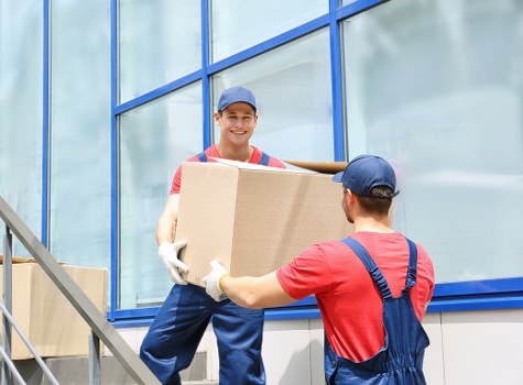 Moving team helping with boxes and furniture in Kentish Town