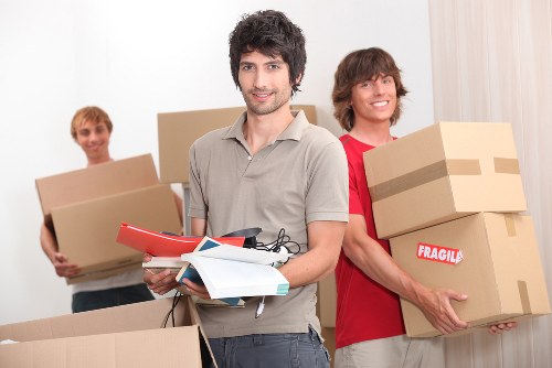 Furniture and boxes being loaded into a moving van