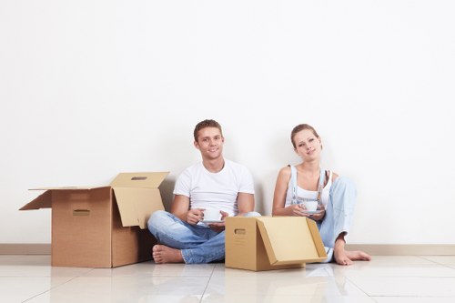Professional movers handling household furniture in Kentishtown