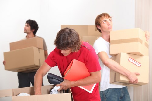 Packed moving boxes and furniture ready for house removals in Kentishtown