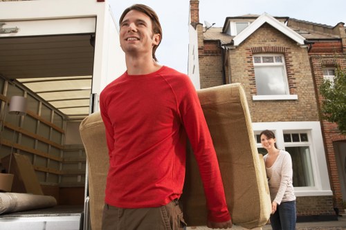 Mixed recycling from a Kentish Town clearance, including paper, textiles, and small appliances