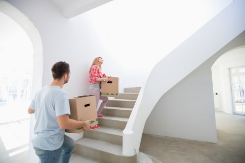 Mover wearing PPE while handling furniture safely