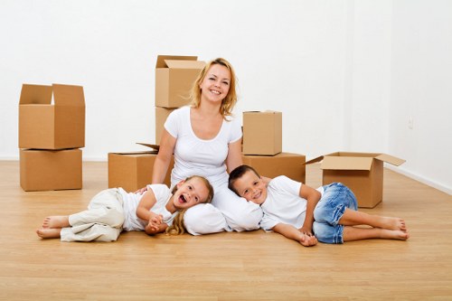 Professional movers packing household items in Kentishtown