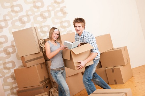 Movers carrying furniture from a flat in Kentish Town