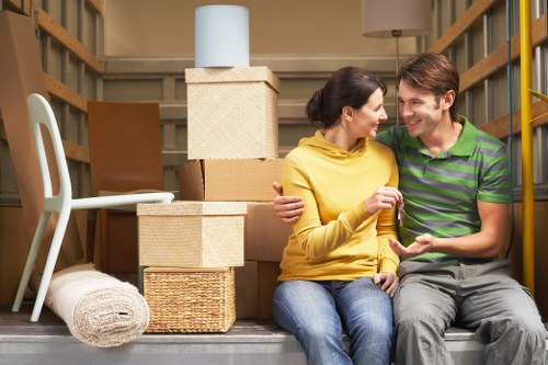 Boxes and furniture being loaded into a moving van